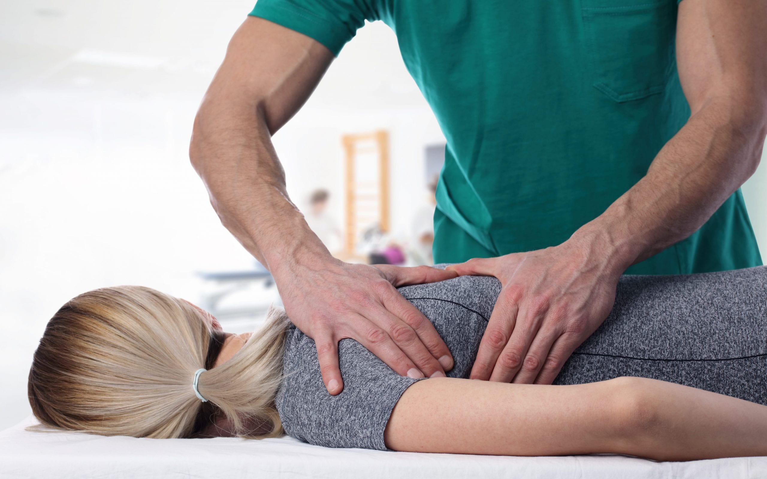 Close up of therapist treating back pain