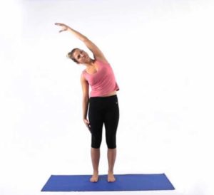 Woman demonstrating standing side stretch
